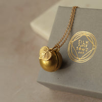 Gold Brass Sphere Locket with Tiny Leaf