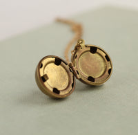 Gold Brass Sphere Locket with Tiny Leaf