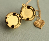 Gold Brass Sphere Locket with Tiny Leaf
