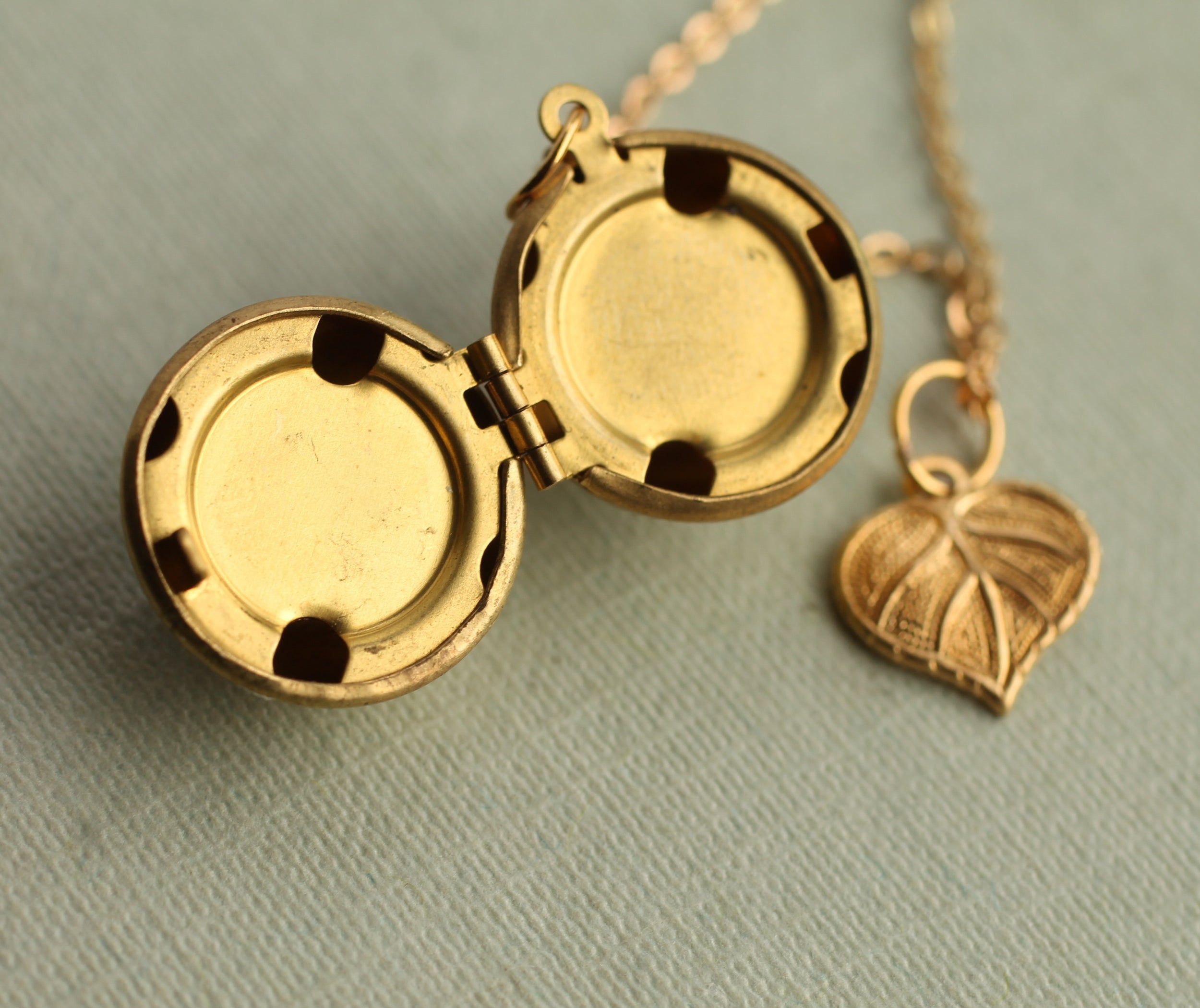 Gold Brass Sphere Locket with Tiny Leaf